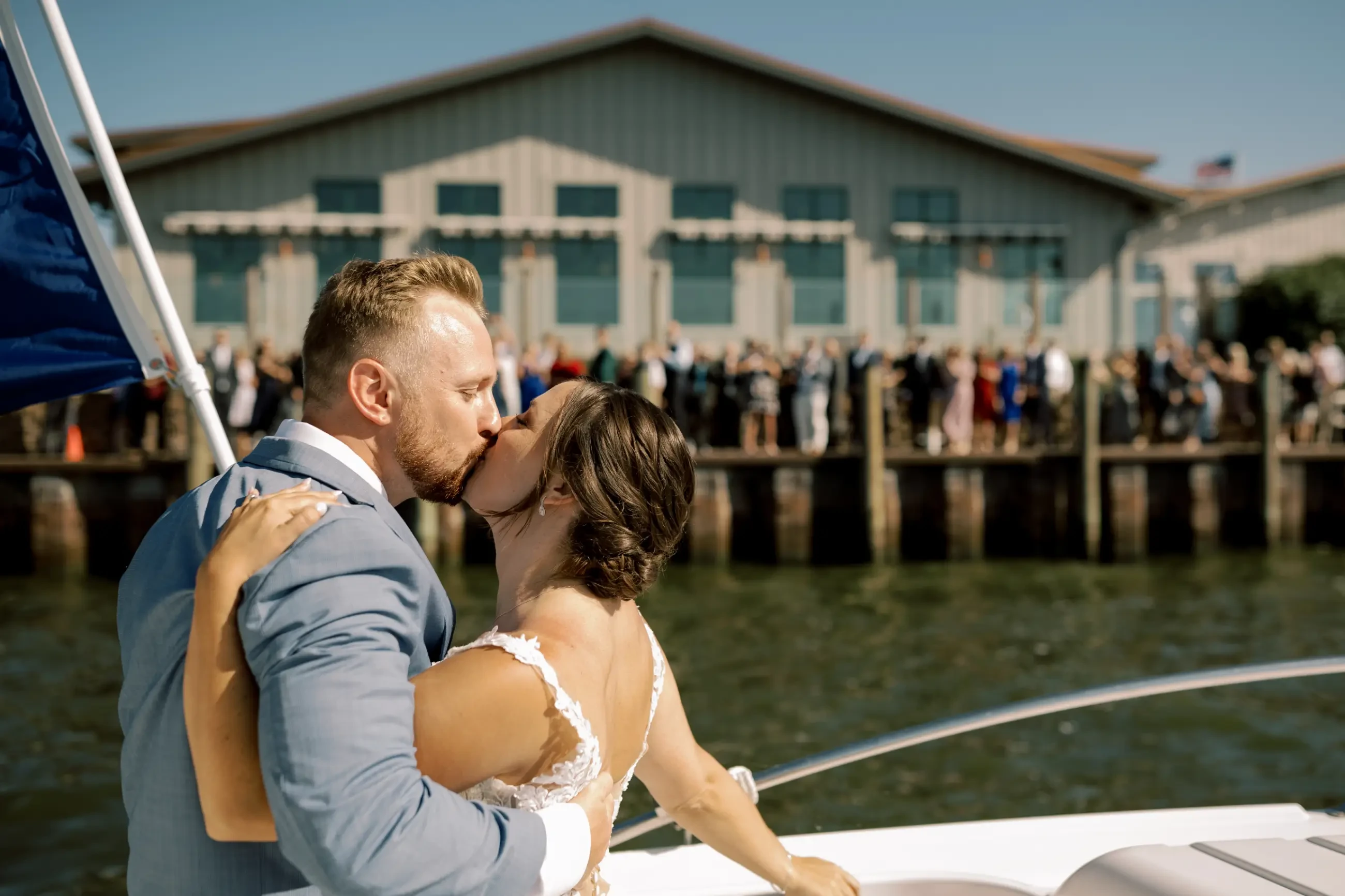 Image shows a husband and wife kissing on their wedding day