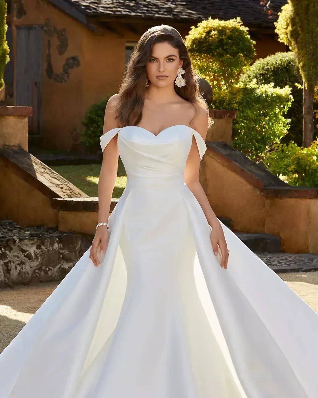Brunette model in white wedding dress