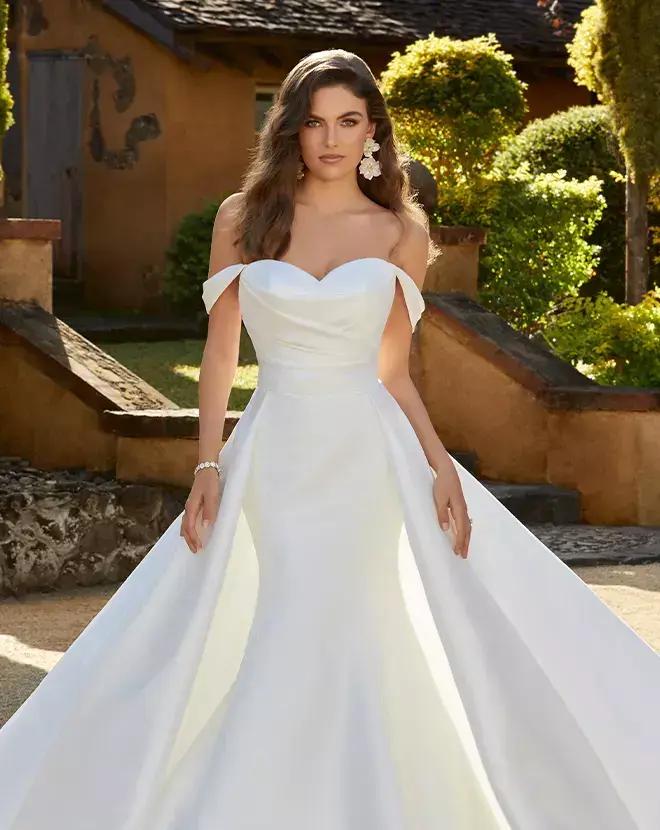 Brunette model in white wedding dress