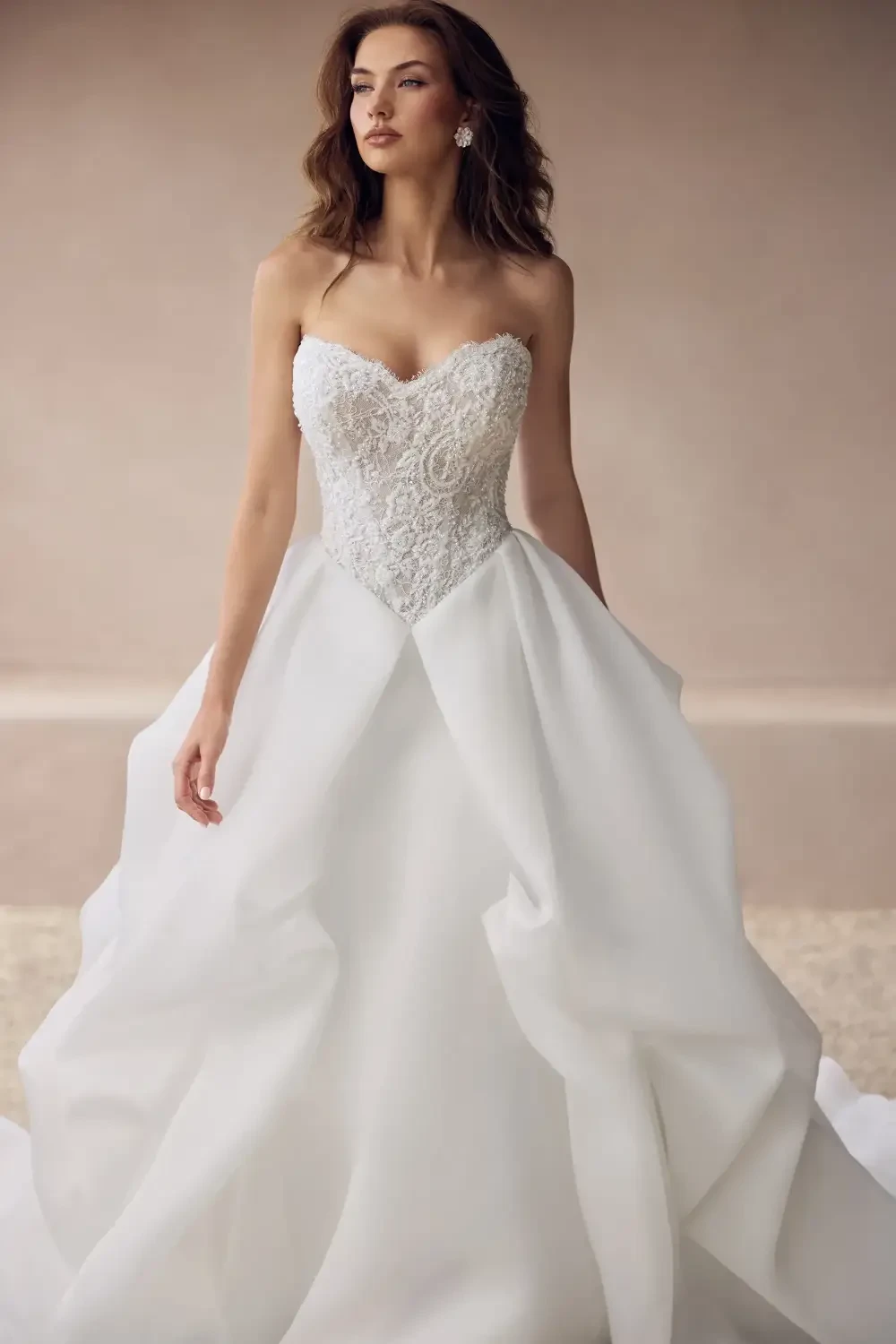 model is wearing a strapless a-line bridal gown