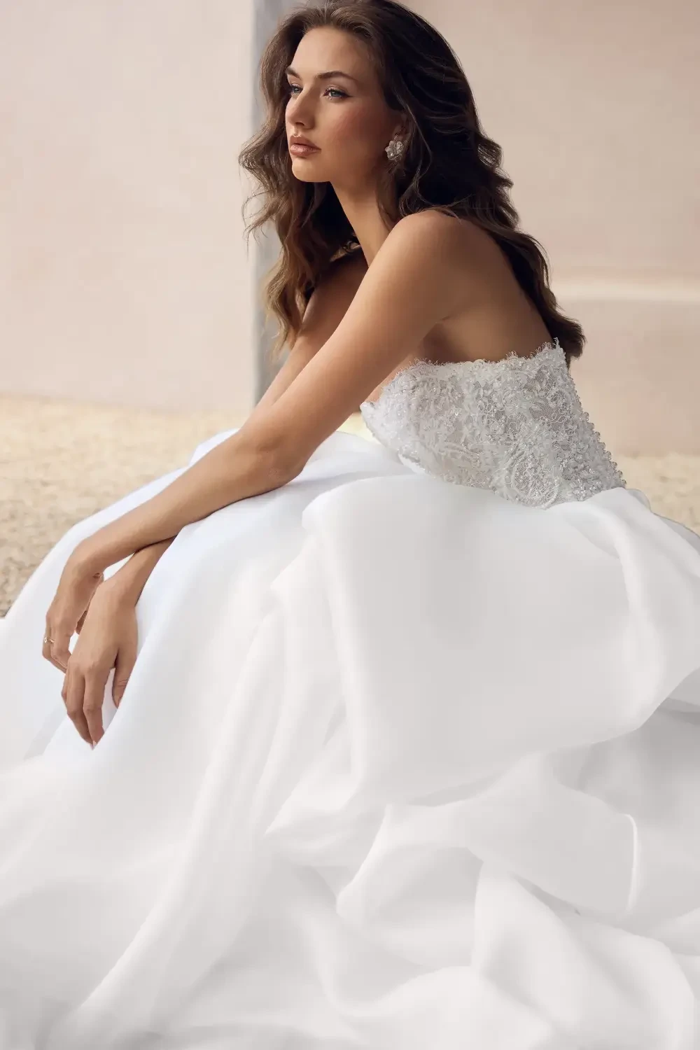 model is wearing a strapless a-line bridal gown
